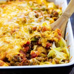 a casserole dish with meat and vegetables in it, ready to be eaten