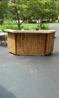 an outdoor bar made out of wooden boards