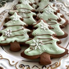 cookies decorated with icing and snowflakes on a plate