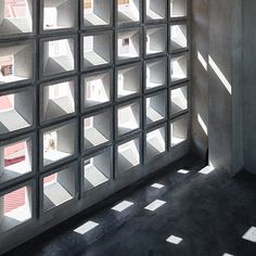 the sun shines through some windows in a building