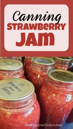 jars filled with jam sitting on top of a table