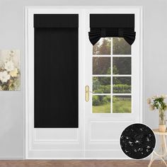 a white front door with black roman shades