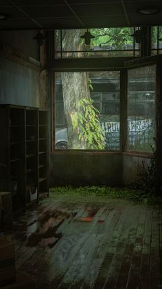 an empty room with lots of green plants in the window and a tree outside it