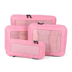 three pieces of pink luggage sitting next to each other