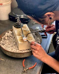 a woman is working on some kind of device