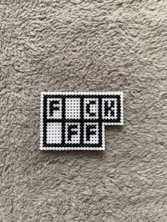 a pixellated sticker on the ground