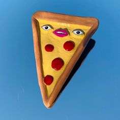 a slice of pizza shaped like a woman's face on a blue sky background