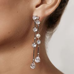 New ~ Anthropologie Shashi Jones Diamond Pearl Drop Earrings Show Stoppers!...Perfect For Any Formal Event. Natural Light Really Makes These Sparkle. Elegant Statement Earrings Feature Cascading Cubic Zirconia Set Stones With Brilliant Droplets On The Ends, Each Adorned With A Single White Pearl. Linked And Free To Sway About, These Are Lightweight And Easy To Wear All Night. Approx. 3"L, 3/8"W. Silver Plated, Cubic Zirconia Aaaa+, Faux Pearl. Post Backs Included. Nwot Shashi For Anthropologie, Elegant White Long Drop Earrings, White Chandelier Earrings With Sparkling Stones For Gift, White Gold Linear Earrings For Party, Glamorous Sparkling White Earrings, White Crystal Chandelier Earrings For Formal Occasions, White Drop Earrings For Evening, White Single Chandelier Earring For Formal Occasions, White Linear Earrings For Pierced Ears For Party, Elegant White Crystal Earrings For Anniversary