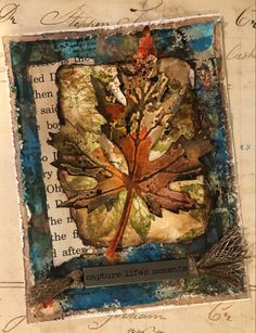 an altered photograph of a leaf with writing on the bottom and below it, as well as some type of art work