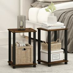 two end tables with baskets on them in front of a bed