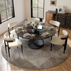 a round glass table with white chairs around it