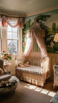 a baby's room with a crib, rocking chair and large painting on the wall