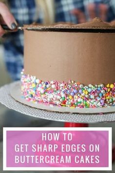 someone is decorating a cake with sprinkles and chocolate frosting on it