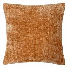 an orange decorative pillow on a white background