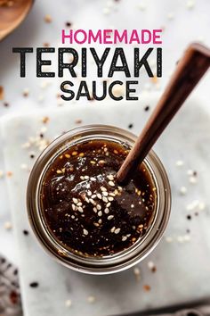 homemade teriyaki sauce in a glass jar with a wooden spoon on the side