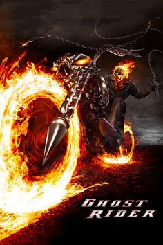 a man riding on the back of a motorcycle with flames coming out of it's tires