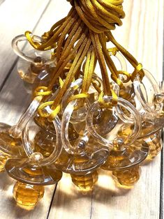 a bunch of glass beads sitting on top of a wooden table