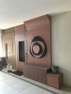 a room that has a large wall with a circular design on the front and back