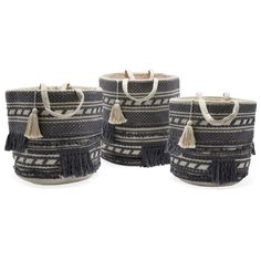 three black and white baskets with tassels