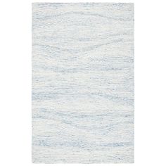 a white and blue rug with wavy lines on the bottom, in front of a white background