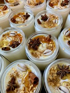 many jars filled with different types of desserts and toppings on top of each other