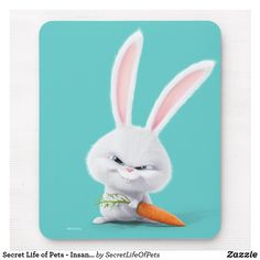 a mouse pad with an image of a rabbit holding a carrot in it's paws