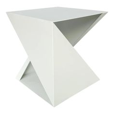 a white table that is very modern and has an unusual design on the top,