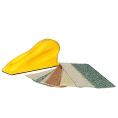 a yellow object sitting on top of a pile of tile next to it's matching colors