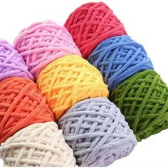 multicolored balls of yarn on white background