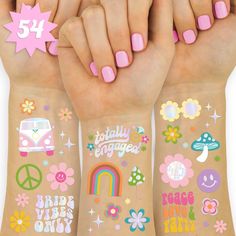 three girls'hands with different tattoos on their arms and one is holding the other hand