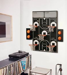 a room with a record player and basketballs hanging on the wall next to it