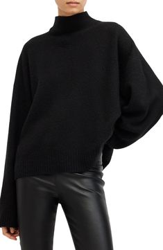 Dramatically sized and definitely warm, this mock-neck sweater is knit from a wool-enriched blend for layer-ready warmth all season long. 22" front length; 25 1/2" back length (size Medium) Mock neck Long sleeves 25% wool, 25% viscose, 22% polyamide, 22% acrylic, 6% elastane Hand wash, line dry Imported