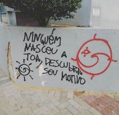 graffiti written on the side of a wall in spanish and english, along with other words