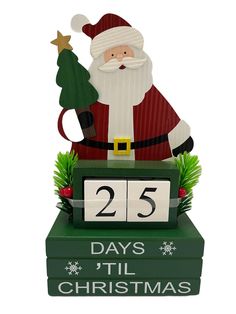 a clock with a santa clause holding a christmas tree on it's face and the date 25 days till christmas