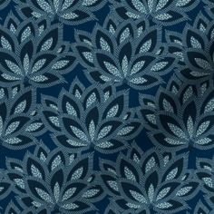 a blue and white wallpaper with leaves on it