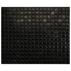 a black tile wall with squares on it