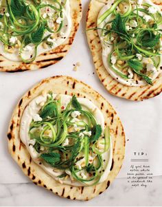 three pita breads topped with cucumber and feta cheese