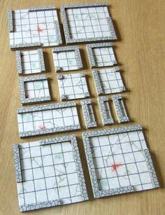 several pieces of white tile sitting on top of a wooden table