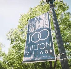 a street sign that says hilton village on it