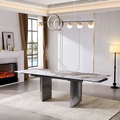 a modern dining table with marble top in front of a fire place and chandelier