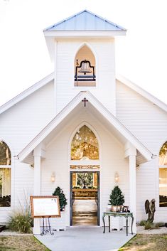 a white church with an open front door