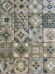 an assortment of tiles with different designs on them