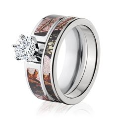 a wedding ring with an animal print pattern and a diamond in the center, set against a white background