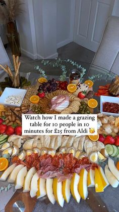 a table filled with lots of different types of fruit and cheeses on top of it