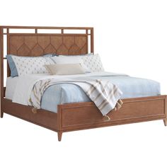 a bed with a wooden headboard and foot board on top of it, in front of a white background