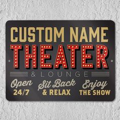 a sign that says your name theater lounge open sit back enjoy 24 / 7 relax the show