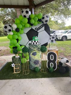 a soccer themed birthday party with balloons and decorations