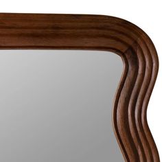 a wooden frame mirror with wavy lines on it