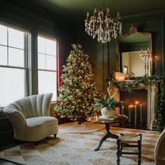 a living room filled with furniture and a christmas tree