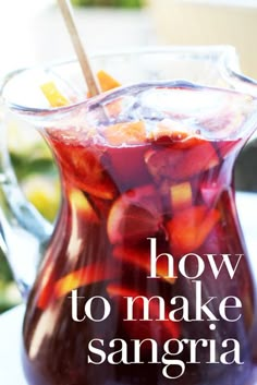 a pitcher filled with liquid sitting on top of a table